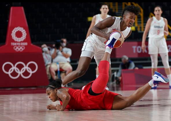 July 26, 2021, Tokyo, Japan: Team Canada shooting guard Shay Colley (bottom) collides with Team Serbia point guard Yvonne Anderson (12) during second half Olympic basketball action at the Tokyo Olympics in Tokyo, Japan on Monday, July 26, 2021. Canada News - July 26, 2021  - ZUMAc35_ 20210726_zaf_c35_015 Copyright: xNathanxDenettex