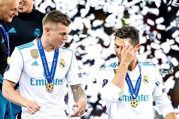 Mandatory Credit: Photo by Robbie Stephenson Jmp Shutterstock (9694113dk) Cristiano Ronaldo of Real Madrid wipes away some confetti as he celebrates with Toni Kroos after their side defeat Liverpool in the Champions League Final Real Madrid v Liverpool, Ukraine - 26 May 2018 EDITORIAL USE ONLY Real Madrid v Liverpool, Ukraine - 26 May 2018 EDITORIAL USE ONLY  Copyright: xRobbiexStephenson Jmp Shutterstockx 9694113dk