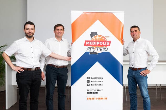 Press conference Basketball BARMER 2 Basketball Bundesliga ProA Science City Jena becomes MEDIPOLIS SC Jena v li Jenas head of finance Benjamin Koppe, Medipolis CEO Dr Christian Wegner and Baskets Jena CEO Lars Eberlein present the new logo Sparkassen Arena Jena