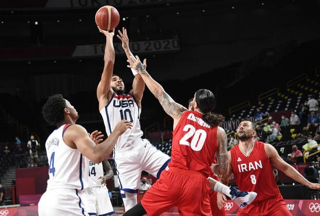United States Jayson Tatum (10) shoots over Iran s Michael Rostampour (20) as teammate Keldon Johnson (L) watches during a Men s Basketball game at the Tokyo 2020 Olympics, Wednesday, July 28, 2021, in Tokyo, Japan. The USA won easily, 120-66.  OLY20210728804 MIKExTHEILER