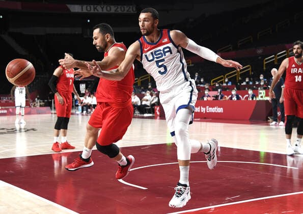 United States Zach Lavine (5) and Iran s Saeid Davarpanah battle for a loose ball during a Men s Basketball game at the Tokyo 2020 Olympics, Wednesday, July 28, 2021, in Tokyo, Japan. The USA won easily, 120-66.  OLY20210728808 MIKExTHEILER