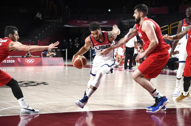 United States Jayson Tatum (10) dribbles through Iran s Aaron Geramipoor (R) and Navid Rezaeifar during a Men s Basketball game at the Tokyo 2020 Olympics, Wednesday, July 28, 2021, in Tokyo, Japan. The USA won easily, 120-66.  OLY20210728810 MIKExTHEILER