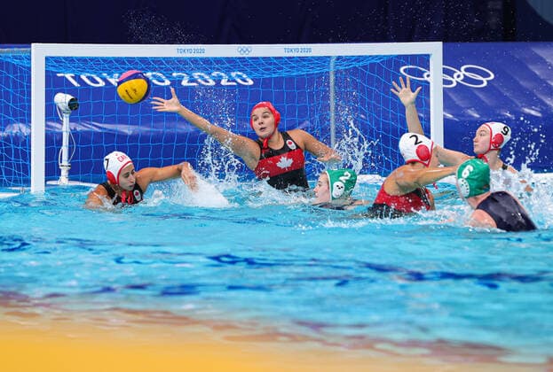 (210728) -- TOKYO, July 28, 2021 -- Clara Vulpisi (2nd L) of Canada defends during the women s Water polo, Wasserball preliminary round match between Canada and South Africa at the 2020 Tokyo Olympic Games, Olympische Spiele, Olympia, OS in Tokyo, Japan, on July 28, 2021. ) (SP)JAPAN-TOKYO-OLYMPICS-WATER POLO-WOMEN S PRELIMINARY WangxJingqiang 
