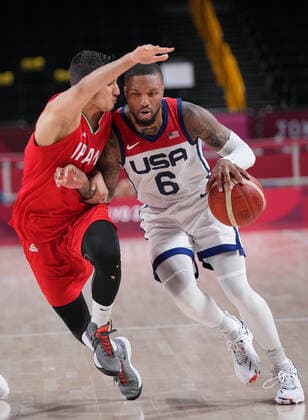 (210728) -- TOKYO, July 28, 2021 -- Damian Lillard (R) of the United States competes during the men s preliminary round match of basketball between the United States and Iran at Tokyo 2020 Olympic Games, Olympische Spiele, Olympia, OS in Saitama, Japan, July 28, 2021. ) (TOKYO2020)JAPAN-SAITAMA-OLY-BASKETBALL-MEN S PRELIMINARY MengxYongmin 