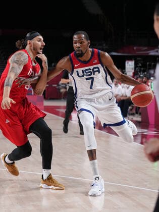(210728) -- TOKYO, July 28, 2021 -- Kevin Durant (R) of the United States competes during the men s preliminary round match of basketball between the United States and Iran at Tokyo 2020 Olympic Games, Olympische Spiele, Olympia, OS in Saitama, Japan, July 28, 2021. ) (TOKYO2020)JAPAN-SAITAMA-OLY-BASKETBALL-MEN S PRELIMINARY MengxYongmin 