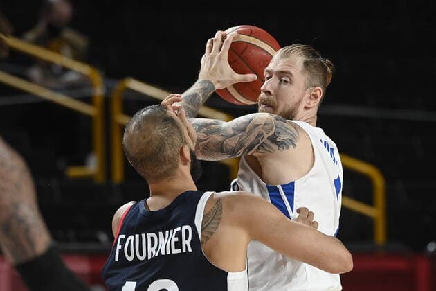 From left Evan Fournier of France and Patrik Auda of Czech Republic in action during the basketball Group A match Czech Republic vs. France in Tokyo 2020 Summer Olympics, Japan, July 28, 2021. (CTKxPhoto OndrejxDeml) CTKPhotoP2021072811062  dml