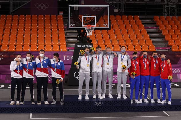TOKYO, JAPAN - JULY 28, 2021: Silver medallists of the ROC Team, gold medallists of Latvia, and bronze medallists of Serbia, from left, pose at a victory ceremony for the men s 3x3 basketball competition at the Tokyo 2020 Summer Olympic Games, Olympische Spiele, Olympia, OS at the Aomi Urban Sports Park. Stanislav Krasilnikov TASS  TS10A12C