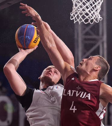 TOKYO, JAPAN - JULY 28, 2021: Latvia s Agnis Cavars (R) blocks ROC s Ilya Karpenkov in their men s 3x3 basketball gold medal match during the Tokyo 2020 Summer Olympic Games, Olympische Spiele, Olympia, OS at the Aomi Urban Sports Park. Stanislav Krasilnikov TASS  TS10A17F