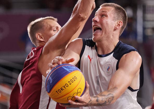 TOKYO, JAPAN - JULY 28, 2021: Latvia s Nauris Miezis (L) defends against ROC s Stanislav Sharov in their men s 3x3 basketball gold medal match during the Tokyo 2020 Summer Olympic Games, Olympische Spiele, Olympia, OS at the Aomi Urban Sports Park. Stanislav Krasilnikov TASS  TS10A180