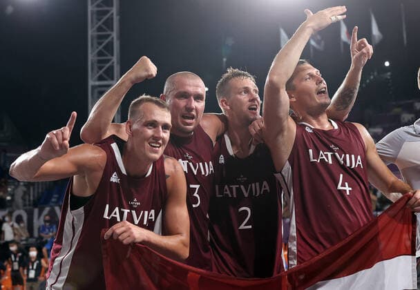 TOKYO, JAPAN - JULY 28, 2021: Latvia s Nauris Miezis, Edgars Krumins, Karlis Lasmanis, and Agnis Cavars (L-R) celebrate winning their men s 3x3 basketball gold medal match against the ROC Team during the Tokyo 2020 Summer Olympic Games, Olympische Spiele, Olympia, OS at the Aomi Urban Sports Park. Stanislav Krasilnikov TASS  TS10A17A
