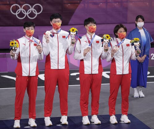 China s Zhiting Zhang, Jiyuan Wan, Lili Wang and Shuyu Yang (L to R) stand on the podium after defeating France to win the bronze medal in Women s 3X3 Basketball at the Tokyo Summer Olympics in Tokyo, Japan, on Wednesday, July 28, 2021. This was the first year 3X3 basketball was an Olympic event.  OLY20210728631 BOBxSTRONG