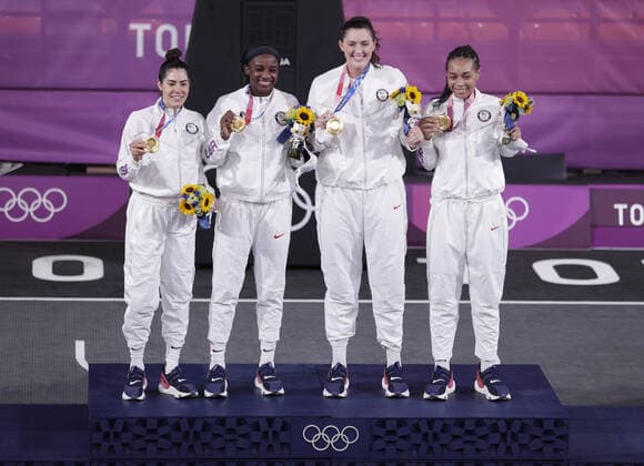 Team USA s Allisha Gray, Kelsey Plum, Stefanie Dolson and Jacquelyn Young (L to R) stand on the podium after defeating Team ROC to win the gold medal in Women s 3X3 Basketball at the Tokyo Summer Olympics in Tokyo, Japan, on Wednesday, July 28, 2021. This was the first year 3X3 basketball was an Olympic event.  OLY20210728635 BOBxSTRONG