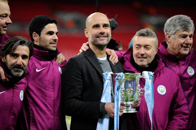 Mandatory Credit: Photo by Holly Allison Tpi Shutterstock (9421946ak) Pep Guardiola of Manchester City celebrates with his coaching team after winning the EFL Cup Final between Arsenal and Manchester City at Wembley Stadium in London. 25 Feb 2018 Arsenal v Manchester City, Premier League, Football, The Emirates Stadium, London, UK - 25 Feb 2018 EDITORIAL USE ONLY No use with unauthorised audio, video, data, fixture lists (outside the EU), club league logos or live services. Online in-match use limited to 45 images (+15 in extra time). No use to emulate moving images. No use in betting, games or single club league player publications services. Arsenal v Manchester City, Premier League, Football, The Emirates Stadium, London, UK - 25 Feb 2018 EDITORIAL USE ONLY No use with unauthorised audio, video, data, fixture lists (outside the EU), club league logos or live services. Online in-match use limited to 45 images (+15 in extra time). No use to emulate moving images. No use in betting, games or  Copyright: xHollyxAllison Tpi Shutterstockx 9421946ak
