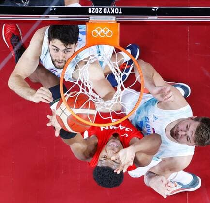 Tokyo Olympics: Basketball Rui Hachimura (red) reaches for the ball during the first quarter of Japan s preliminary-round game against Slovenia in the Tokyo Olympic men s basketball on July 29, 2021, at Saitama Super Arena near Tokyo.  A14AA0000755013P