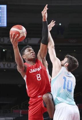 Tokyo Olympics: Basketball Japan s Rui Hachimura (L) shoots over Slovenia s Mike Tobey during the first quarter of their basketball preliminary-round game of the Tokyo Olympics on July 29, 2021, at Saitama Super Arena near Tokyo. (SELECTION)  A14AA0000755012P