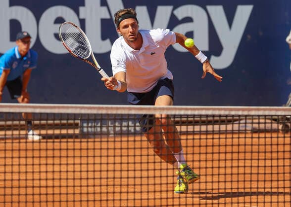 Arthur Rinderknech FRA plays a forehand volley at the net, Copyright: xJuergenxHasenkopfx