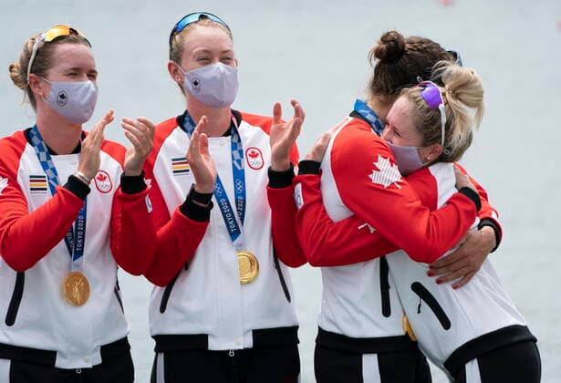 July 30, 2021, Tokyo, Japan: CanadaÃ¢â‚¬â ¢s Madison Mailey and Sydney Payne, look on as Avalon Wasteneys hugs Kristen Kit after presenting her with the gold medal in womenÃ¢â‚¬â ¢s eight rowing competition at the Tokyo Olympics, Friday, July 30, 2021 in Tokyo, Japan. Lisa Roman Kasia Gruchalla-Wesierski Christine Roper Andrea Proske Susanne Grainger Madison Mailey Sydney Payne Avalon Wasteneys  - ZUMAc35_ 20210730_zaf_c35_007 Copyright: xAdrianxWyldx
