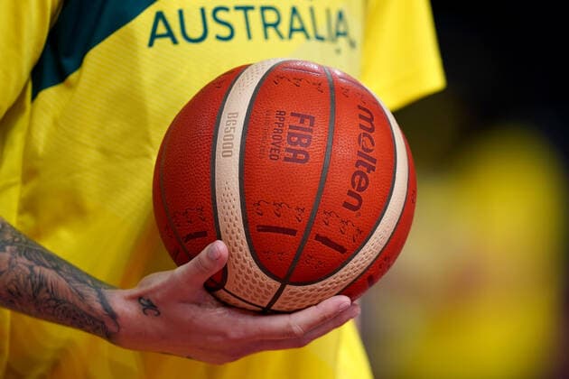 OLY21 BASKETBALL WOMENS AUST CHINA, A member of the Australian team coaching staff holds ball during the warm up, ahead of the Women s Preliminaries Group C Basketball match between China and Australia at the Saitama Super Arena during the Tokyo Olympic Games, Olympische Spiele, Olympia, OS in Tokyo, Japan Friday, July 30, 2021. ( NO ARCHIVING, EDITORIAL USE ONLY, NO USE IN BOOKS WITHOUT CONSENT TOKYO JAPAN  Copyright: xJOExGIDDENSx 20210730001562105119