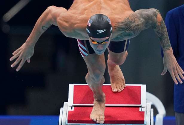 (210731) -- TOKYO, July 31, 2021 -- Caeleb Dressel of the United States enters water during the men s 100m butterfly final at the Tokyo 2020 Olympic Games, Olympische Spiele, Olympia, OS in Tokyo, Japan, July 31, 2021. ) (TOKYO2020)JAPAN-TOKYO-OLY-SWIMMING-MEN-100M BUTTERFLY XuxChang 