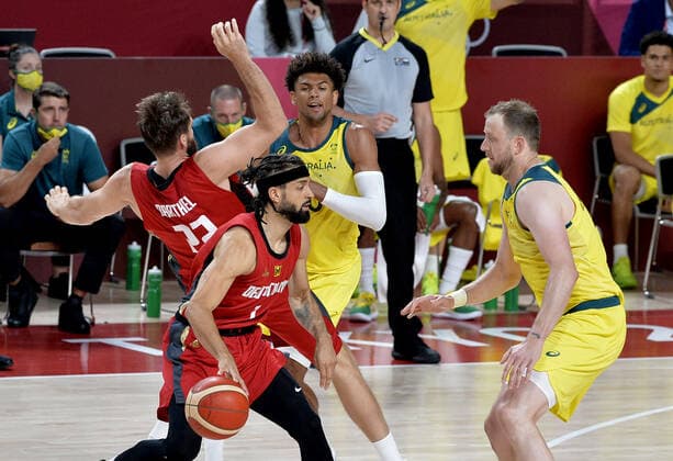 Germany s Joshiko Saibou (L) is defended by Australia s Joe Ingles as his teammate Danilo Barthel collides with Australia s Matisse Thybulle during Men s Basketball game at the Tokyo 2020 Olympics, Saturday, July 31, 2021, in Tokyo, Japan.  OLY20210731816 MIKExTHEILER