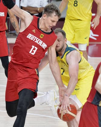 Germany s Moritz Wagner (13) battles for the basketball with Australia s Joe Ingles during Men s Basketball game at the Tokyo 2020 Olympics, Saturday, July 31, 2021, in Tokyo, Japan. Australia defeated Germany 89-76.  OLY20210731817 MIKExTHEILER
