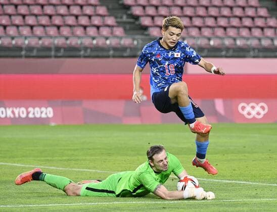 Tokyo Olympics: Football New Zealand goalkeeper Michael Woud (bottom) catches the ball as Doan Ritsu of Japan challenges him during the second half of their men s football quarterfinal of the Tokyo Olympics on July 31, 2021, at Kashima Stadium in Ibaraki Prefecture, eastern Japan.  A14AA0000755554P