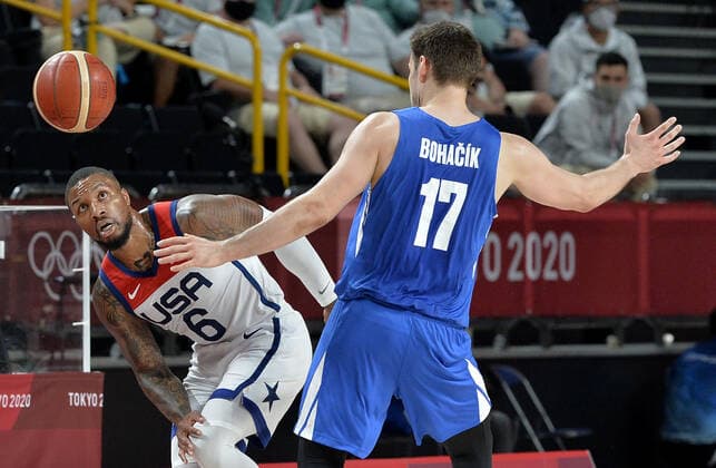 The ball is up for grabs by United States Damian Lillard (L) and Czechoslovakia s Jaromir Bohacik during a Men s Basketball game at the Tokyo 2020 Olympics, Saturday, July 31, 2021, in Tokyo, Japan. USA won, 119-84.  OLY20210731840 MIKExTHEILER