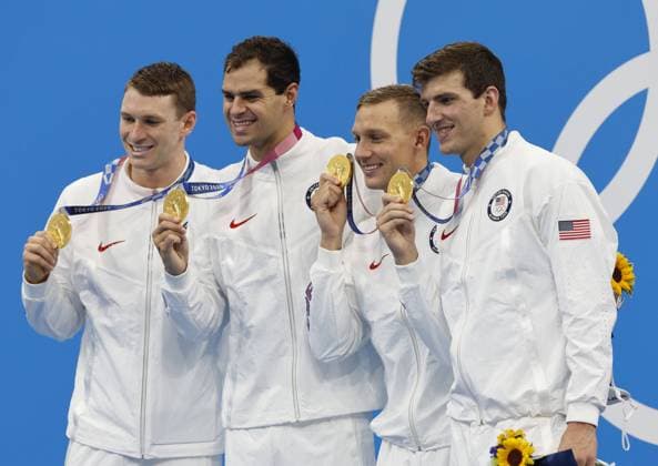 USA s Ryan Murphy, Michael Andrew, Caeleb Dressel, and Zach Apple stand on the awards podium following their World Record 3:26.78 to win the Men s 4 X 100 Medley Relay Final at the Tokyo Aquatics Centre during the 2020 Summer Olympics in Tokyo, Japan on Sunday, August 1, 2021.  OLY20210801444 TASOSxKATOPODIS