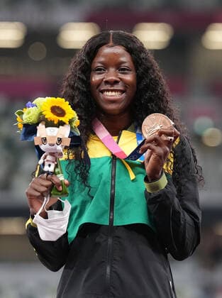 (210801) -- TOKYO, Aug. 1, 2021 -- Shericka Jackson of Jamaica reacts during the awarding ceremony of the Women s 100m at the Tokyo 2020 Olympic Games, Olympische Spiele, Olympia, OS in Tokyo, Japan, Aug. 1, 2021. ) (TOKYO2020)JAPAN-TOKYO-OLY-ATHLETICS-WOMEN S 100M-AWARDING CEREMONY JuxHuanzong 
