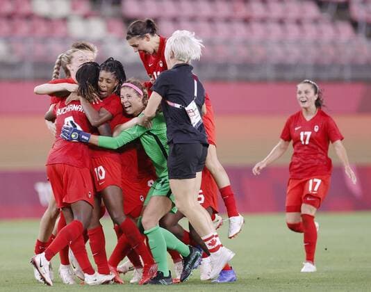 Tokyo Olympics: Football Canadian players celebrate after upsetting the United States in their Tokyo Olympic women s football semifinal on Aug. 2, 2021, at Kashima Stadium in Ibaraki Prefecture, eastern Japan. (SELECTION)  A14AA0000756002P