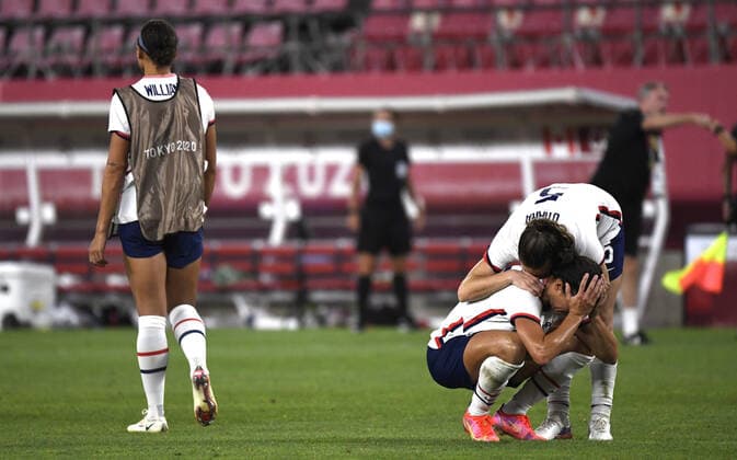 United States Kelley O Hara consoles Carli Lloyd as she buries her face in her hands after the USA loss to Canada in the Women s Soccer semi-final match at the Tokyo 2020 Olympics, Monday, August 2, 2021, in Kashima, Japan. Canada defeated the USA 1-0 on a penalty kick.  OLY20210802807 MIKExTHEILER