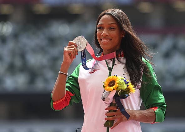 (210802) -- TOKYO, Aug. 2, 2021 -- Patricia Mamona of Portugal reacts during the awarding ceremony of the Women s Triple Jump at the Tokyo 2020 Olympic Games, Olympische Spiele, Olympia, OS in Tokyo, Japan, Aug. 2, 2021. ) (TOKYO2020)JAPAN-TOKYO-OLY-ATHLETICS-WOMEN S TRIPLE JUMP-AWARDING CEREMONY JiaxYuchen 