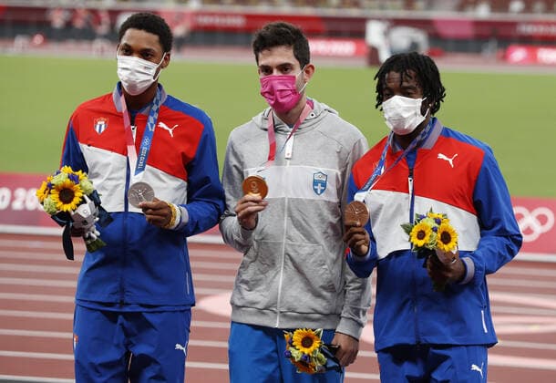 Gold medalist Miltiadis Tentoglou of Greece (C), Silver medalist Juan Miguel Echevarria of Cuba (L) and Bronze medalist Maykel Masso of Cuba stand on the podium at the awards ceremony for the Men s Long Jump at Olympic Stadium during the 2020 Summer Olympics in Tokyo, Japan on Sunday, August 2, 2021.  OLY20210802458 TASOSxKATOPODIS