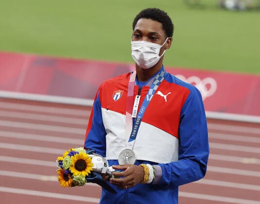 Silver medalist Juan Miguel Echevarria of Cuba stands on the podium at the awards ceremony for the Men s Long Jump at Olympic Stadium during the 2020 Summer Olympics in Tokyo, Japan on Sunday, August 2, 2021.  OLY20210802461 TASOSxKATOPODIS