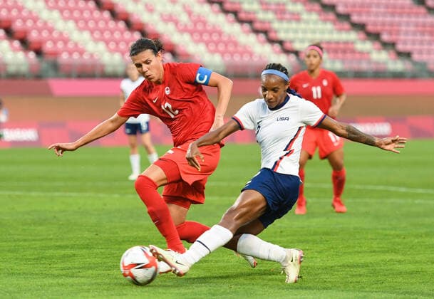 (210802) -- IBARAKI, Aug. 2, 2021 -- Crystal Dunn (R) of the United States vies with Christine Sinclair of Canada during the women s football semifinal match between the United States and Canada at Tokyo 2020 Olympic Games, Olympische Spiele, Olympia, OS in Ibaraki, Japan, Aug. 2, 2021. ) (TOKYO2020)JAPAN-MIYAGI-WOMEN S FOOTBALL-SEMIFINAL-USA VS CAN LuxYang 