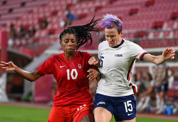 (210802) -- IBARAKI, Aug. 2, 2021 -- Megan Rapinoe (R) of the United States vies with Ashley Lawrence of Canada during the women s football semifinal match between the United States and Canada at Tokyo 2020 Olympic Games, Olympische Spiele, Olympia, OS in Ibaraki, Japan, Aug. 2, 2021. ) (TOKYO2020)JAPAN-MIYAGI-WOMEN S FOOTBALL-SEMIFINAL-USA VS CAN LuxYang 