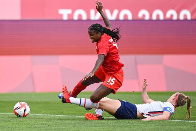 (210802) -- IBARAKI, Aug. 2, 2021 -- Nichelle Prince (top) of Canada takes the ball over Becky Sauerbrunn of the United States during the women s football semifinal match between the United States and Canada at Tokyo 2020 Olympic Games, Olympische Spiele, Olympia, OS in Ibaraki, Japan, Aug. 2, 2021. ) (TOKYO2020)JAPAN-MIYAGI-WOMEN S FOOTBALL-SEMIFINAL-USA VS CAN LuxYang 