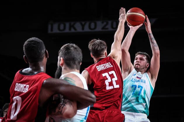 (210803) -- SAITAMA, Aug. 3, 2021 -- Luka Doncic (1st R) of Slovenia shoots during the men s basketball quarterfinal match between Slovenia and Germany at Tokyo 2020 Olympic Games, Olympische Spiele, Olympia, OS in Saitama, Japan, Aug. 3, 2021. ) (TOKYO2020)JAPAN-SAITAMA-OLY-BASKETBALL-MEN S QUARTERFINAL-SLO VS GER PanxYulong 