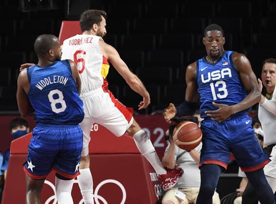 Spain s Sergio Rodriguez (6) loses the ball between United States defenders Khris Middleton (8) and Bam Adebayo during Men s Basketball quarterfinal game at the Tokyo 2020 Olympics, Tuesday, August 3, 2021, in Tokyo, Japan. USA won, 95-81 to advance to the semi-finals.  OLY20210803810 MIKExTHEILER