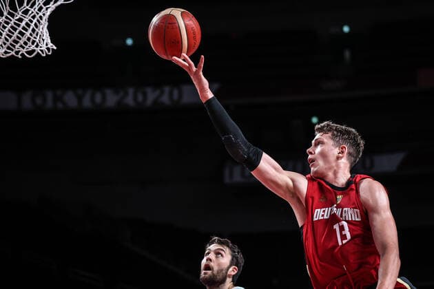 (210803) -- SAITAMA, Aug. 3, 2021 -- Moritz Wagner (R) of Germany goes up for a layup during the men s basketball quarterfinal match between Slovenia and Germany at Tokyo 2020 Olympic Games, Olympische Spiele, Olympia, OS in Saitama, Japan, Aug. 3, 2021. ) (TOKYO2020)JAPAN-SAITAMA-OLY-BASKETBALL-MEN S QUARTERFINAL-SLO VS GER PanxYulong 