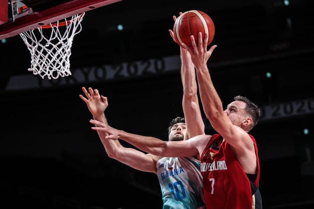 (210803) -- SAITAMA, Aug. 3, 2021 -- Johannes Voigtmann (R) of Germany goes up for a basket during the men s basketball quarterfinal match between Slovenia and Germany at Tokyo 2020 Olympic Games, Olympische Spiele, Olympia, OS in Saitama, Japan, Aug. 3, 2021. ) (TOKYO2020)JAPAN-SAITAMA-OLY-BASKETBALL-MEN S QUARTERFINAL-SLO VS GER PanxYulong 