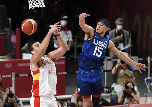 United States Devin Booker (R) and Spain s Marc Gasol battles for a rebound during Men s Basketball quarterfinal game at the Tokyo 2020 Olympics, Tuesday, August 3, 2021, in Tokyo, Japan. USA won 95-81 to advance to the semi-final round.  OLY20210803812 MIKExTHEILER