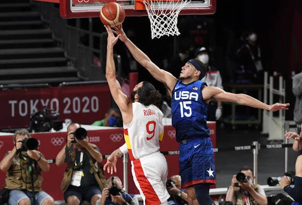 United States Devin Booker (R) blocks a lay up by Spain s Ricky Rubio during Men s Basketball quarterfinal game at the Tokyo 2020 Olympics, Tuesday, August 3, 2021, in Tokyo, Japan. USA won 95-81 to advance to the semi-final round.  OLY20210803813 MIKExTHEILER