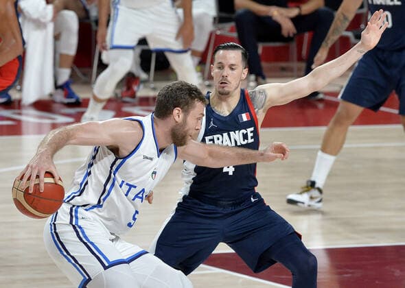France s Thomas Heurtel defends Italy s Nicolo Melli who drives with the basketball during the Men s Basketball quarterfinal game at the Tokyo 2020 Olympics on Tuesday, August 3, 2021, in Tokyo, Japan.  OLY20210803819 MIKExTHEILER