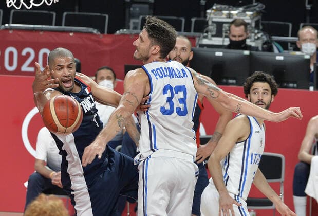 Italy s Achille Polonara (33) and France s Nicolas Batum battle for a rebound during the Men s Basketball quarterfinal game at the Tokyo 2020 Olympics on Tuesday, August 3, 2021, in Tokyo, Japan.  OLY20210803821 MIKExTHEILER