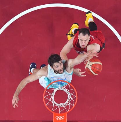 (210803) -- SAITAMA, Aug. 3, 2021 -- Mike Tobey (L) of Slovenia competes with Johannes Voigtmann of Germany during the men s basketball quarterfinal match between Slovenia and Germany at Tokyo 2020 Olympic Games, Olympische Spiele, Olympia, OS in Saitama, Japan, Aug. 3, 2021. ) (TOKYO2020)JAPAN-SAITAMA-OLY-BASKETBALL-MEN S QUARTERFINAL-SLO VS GER MengxYongmin 