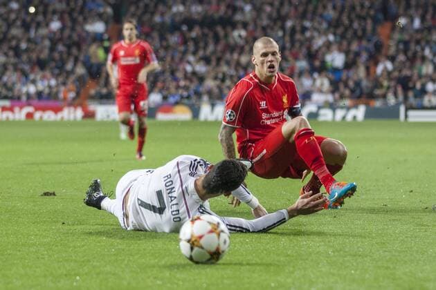 Mandatory Credit: Photo by Sergio Lopez BPI Shutterstock (4231722ct) Cristiano Ronaldo of Real Madrid is fouled by Martin Skrtel of Liverpool UEFA Champions League 2014 15 Group Stage Group B Real Madrid v Liverpool Santiago Bernabéu Stadium, Madrid, Spain - 4 Nov 2014 EDITORIAL USE ONLY UEFA Champions League 2014 15 Group Stage Group B Real Madrid v Liverpool Santiago Bernabéu Stadium, Madrid, Spain - 4 Nov 2014 EDITORIAL USE ONLY  Copyright: xSergioxLopez BPI Shutterstockx 4231722ct