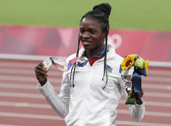 Namibia s Christine Mboma celebrates her Silver medal for the Women s 200m final with a time of 21.81 during medal ceremony at the Olympic Stadium during the 2020 Summer Olympics in Tokyo, Japan on Wednesday, August 4, 2021.  OLY20210804461 TASOSxKATOPODIS