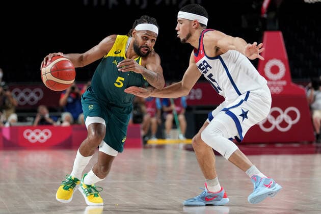 OLY21 MENS BASKETBALL AUST USA, Patty Mills of Australia drives past Devin Booker of the USA during the Men s Semifinal Basketball match between the USA and Australia at the Saitama Super Arena during the Tokyo Olympic Games, Olympische Spiele, Olympia, OS in Tokyo, Japan Thursday, August 5, 2021. ( NO ARCHIVING, EDITORIAL USE ONLY, NO USE IN BOOKS WITHOUT CONSENT TOKYO JAPAN  Copyright: xJOExGIDDENSx 20210805001564347947