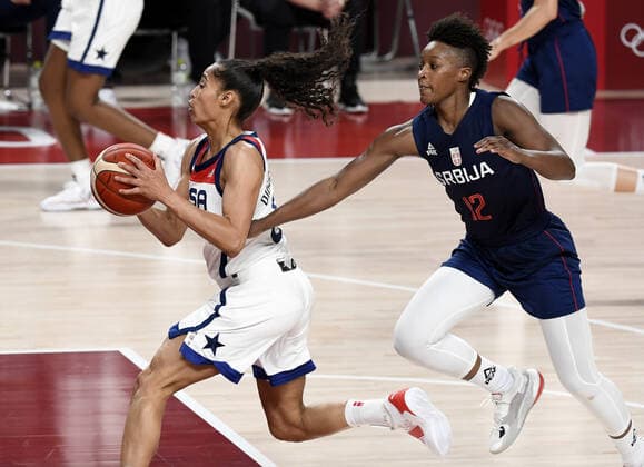 United States Skylar Diggins (L) is fouled from behind by Serbia s Yvonne Anderson during the Women s Basketball semifinal at the Tokyo 2020 Olympics, Friday, August 6, 2021, in Tokyo, Japan. USA won, 70-59 to advance to the Gold Medal game.  OLY20210806802 MIKExTHEILER